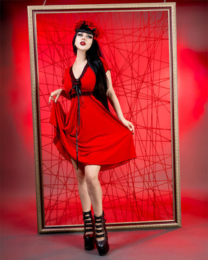 Cherry Red in front of frame wearing Dare to Wear Gothic Medieval Renaissance Angel Corset Frock Dress in Vermillion